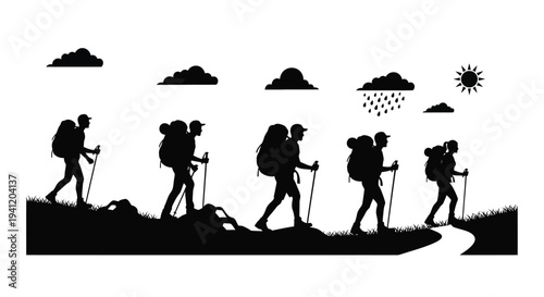 Silhouette hikers ascending a grassy hill towards a bright sun