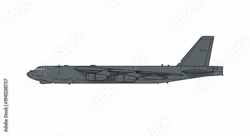 A large military aircraft is flying through a clear blue sky with its tail visible.