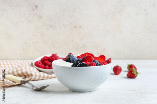 Bowl of tasty yogurt with d...