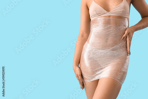 Young woman in stretch film...