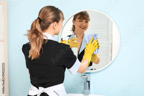 Smiling maid with detergent...