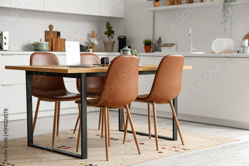 Wooden table with laptop, t...