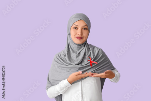 Beautiful Muslim woman poin...