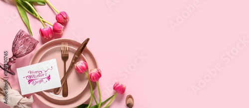 Table setting for Mother's day celebration and tulip flowers on pink background with space for text