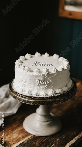 National Nana Day Elegant white cake with floral frosting decor on rustic stand