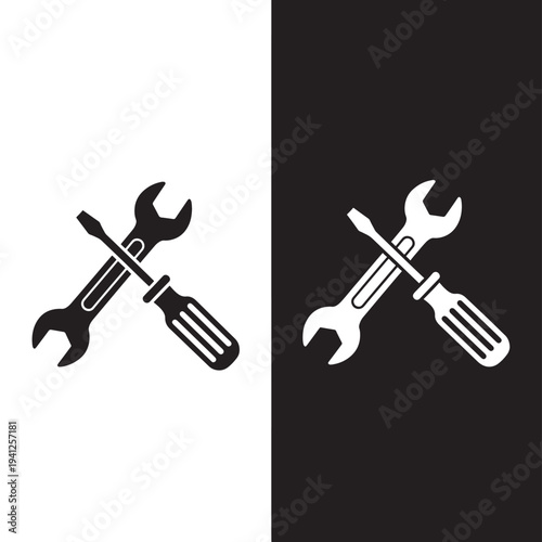 Wrench and screwdriver crossed tools icon, representing repair and construction, available in black and white.