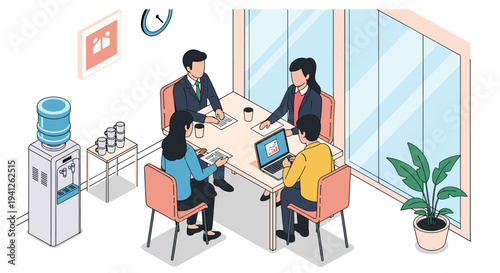 Group of four business professionals sitting around a table in a bright office discussing project data on laptops and documents.