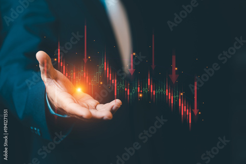 Businessman hand showing falling stock market candle graph with red arrows. Concept of financial crisis, investment loss and economic recession.