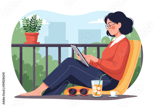 Woman relaxing on a balcony with a laptop and city view.