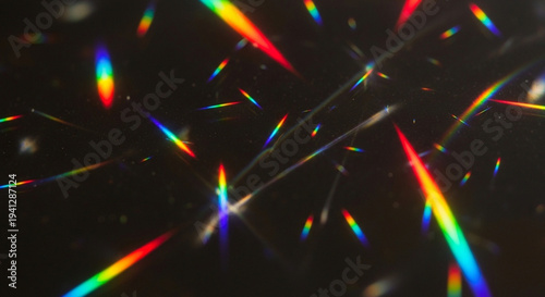 Canvas Print Vibrant rainbow light refractions on a sleek black background with colorful beam