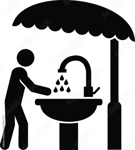 Person washing hands at outdoor faucet