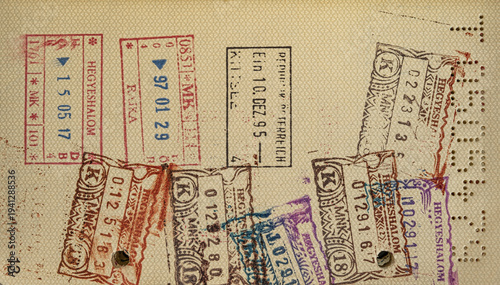 Well-Travelled Passport Vintage Passport Open to Pages Filled with International Entry and Exit