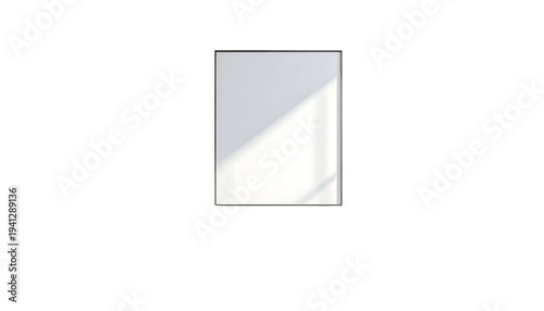 Rectangular white frame against black background with window light casting diagonal shadow