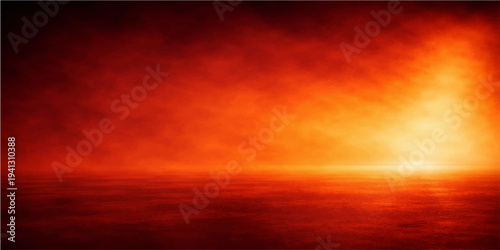 Dramatic abstract background of fiery red clouds and golden sunlight reflecting a beautiful sunset sky over a summer landscape at dusk