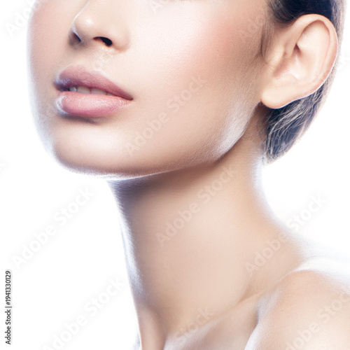 Close-up beauty face, young fashion model woman, perfect skin, nude makeup, natural lips