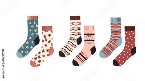 Set of three pairs of stylishly patterned socks in warm autumn tones featuring leaves, stripes, and polka dot designs.