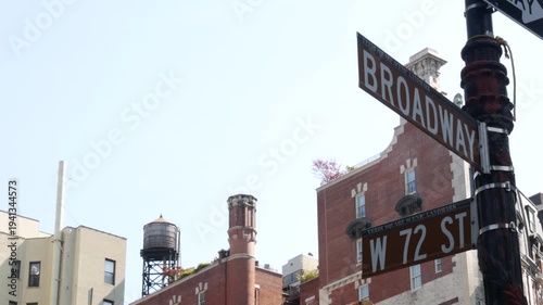 New York City Broadway street sign on Manhattan, United States. Urban road sign in american city. Traffic sign in Midtown of NYC, USA. Red building architecture in West side district, 72 street corner