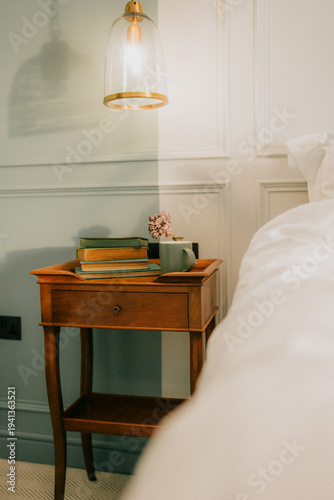 Bild auf Leinwand Cozy corner with vintage wooden nightstand