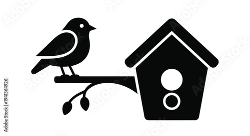 A small bird perched on a branch near its simple birdhouse