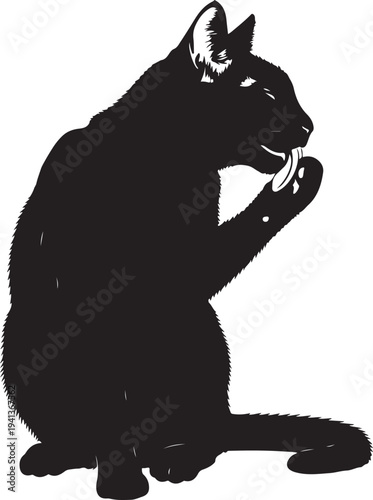 Silhouette of a cat sitting and eating