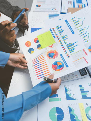 Auditor and accountant team working in office, analyze financial data and accounting record with calculator. Accounting company provide finance and taxation planning for profitable cash flow.