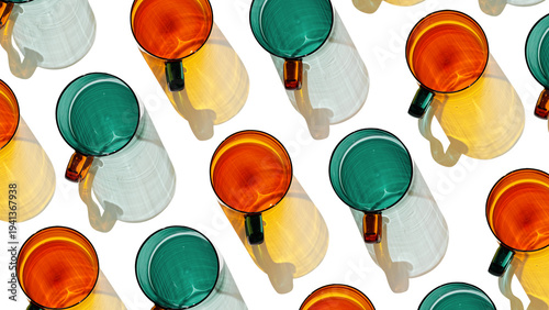 Colored shiny drink Glasses banner with shadow and sunlight reflections on white, minimal aesthetic top view summer photo, refraction at glass orange green cups, trend pattern, diagonal layout