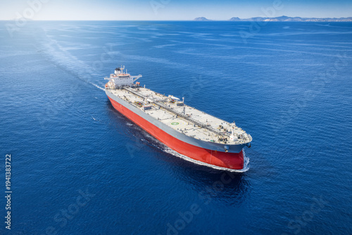 Aerial view of a large super tanker for crude oil traveling fast over the ocean
