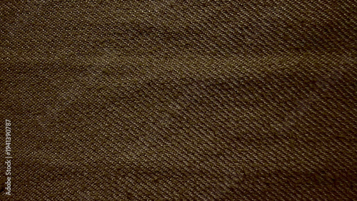 earthy brown twill denim fabric texture macro closeup reveals intricate diagonal weave pattern natural tactile folds