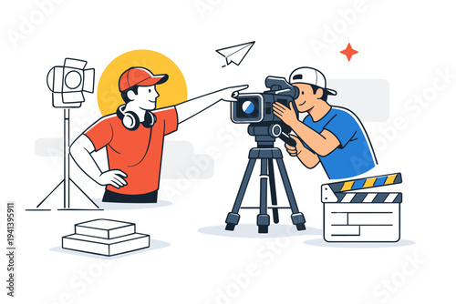 Framing the perfect shot. The director points confidently toward an imaginary frame while the cinematographer rotates the camera slightly, adjusting