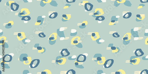 Seamless vector pattern with abstract organic shapes in blue and yellow on soft pastel background. Modern hand drawn texture perfect for fabric, wallpaper and trendy decor