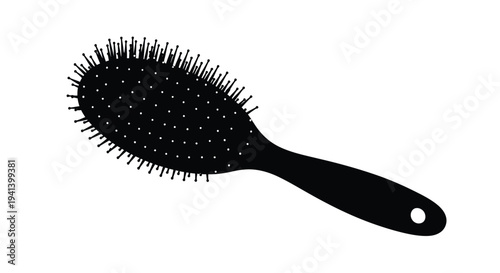 Black hairbrush isolated on a white background a striking silhouette