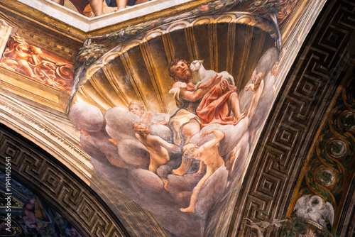 Detailed fresco of a prophet or saint holding a lamb in a decorative archway of the Parma Cathedral, Italy 06.01.2026