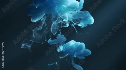 Ethereal blue smoke swirling in dark background abstract motion