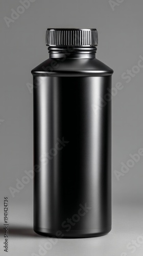 Sleek black protein shake bottle on a charcoal gray studio setting, emphasizing minimalist design and modern aesthetics