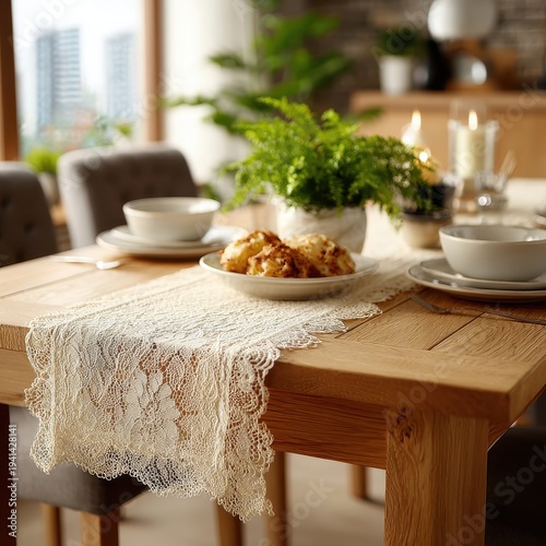 Elegant Dining Table Setting with Lace Runner, Dishes, and Greenery