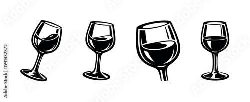 Black and white vector silhouette of wine glasses in various angles