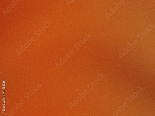 Fotografie Close-up view of a textured orange-brown fabric surface with subtle graininess