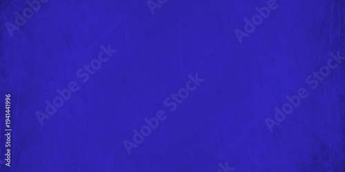 dark blue grunge background texture with scratches, distressed cobalt paper effect for website header and poster design