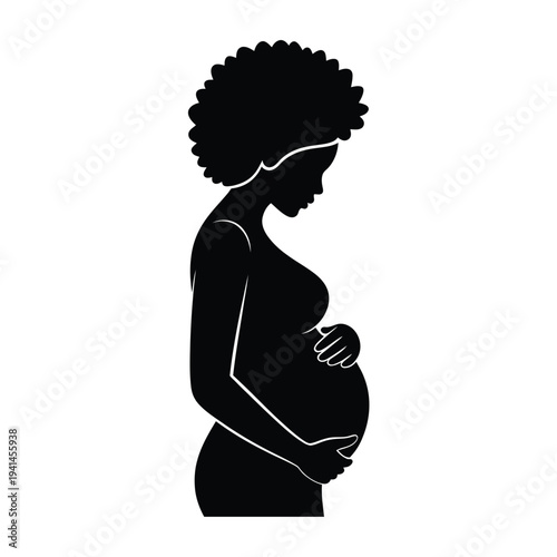 A silhouette of a pregnant woman gently cradling her baby bump