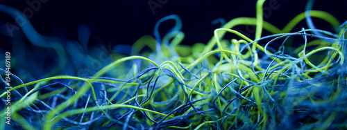 Abstract background of glowing tangled neon threads representing quantum entanglement and complex digital data networks in a dark void