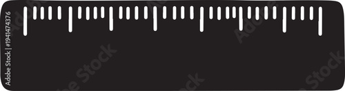 Black ruler with white markings on a plain background