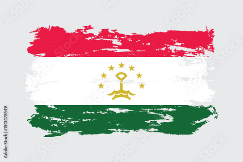 Tajikistan flag painted with a brushstroke. Abstract concept. National flag in grunge style.