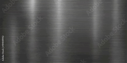 A polished silver stainless steel sheet displays a brushed metal texture with a shiny industrial gray surface and smooth metallic reflections on a professional aluminum plate background