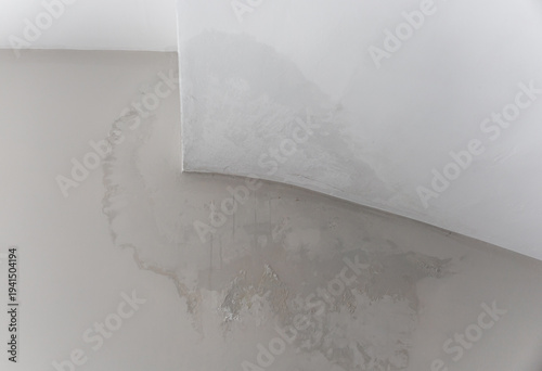 Water damage on interior wall from heavy rain leak, home insulation problem