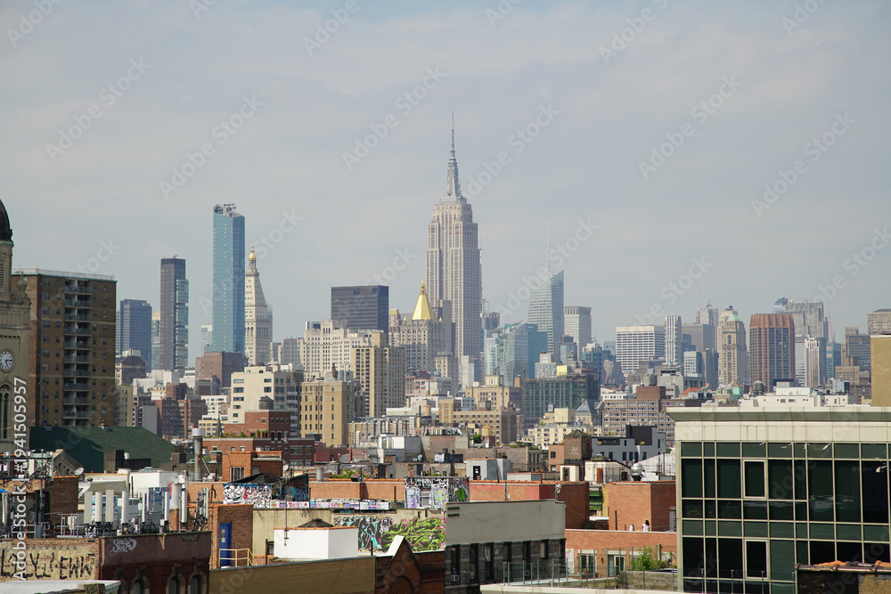 Fototapeta premium Views of New York City skyline with Empire State Building during daytime