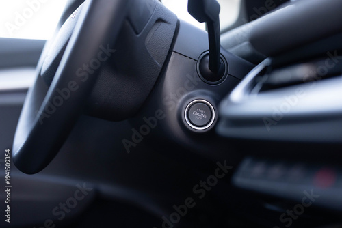 Button to start the car engine. Pressing Stand By Power Button To Turn On and Off the Electric Car. Pushing start stop Button to start keyless ignition hybrid car electro engine. Starting car engine