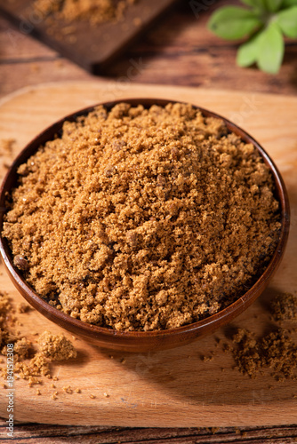 Canvas-taulu brown sugar on table. Raw unrefined cane sugar