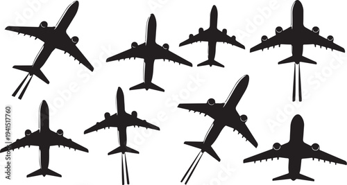 Silhouettes of airplanes in various flight positions and angles