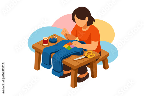 Woman sewing blue jeans with colorful patch on wooden table.