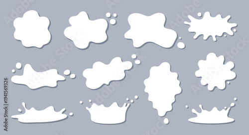 A collection of abstract white splashes and blots against a muted gray background exhibiting a clean silhouette high quality professional detailed